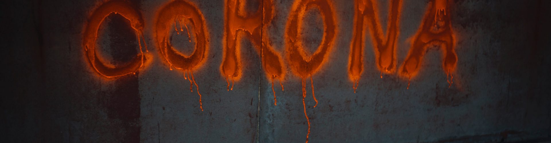 Corona lettering with orange spray paint. Protest sign Corona lettering with orange spray paint. Protest sign on abandoned wall